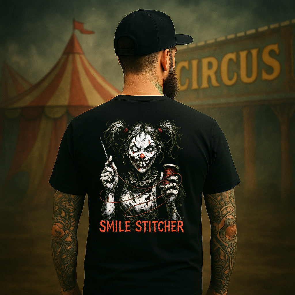 Person wearing a black t-shirt with a clown graphic and 'Smile Stitcher' text, standing in front of a circus tent.