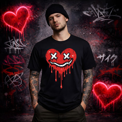 Man wearing a black t-shirt with a red heart design against a graffiti-covered wall.